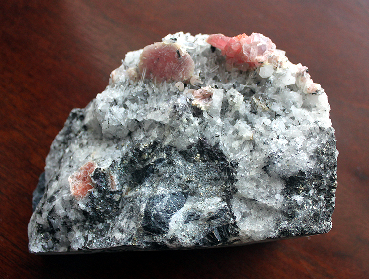 red crystals of Rhodochrosite on a matrix of quartz